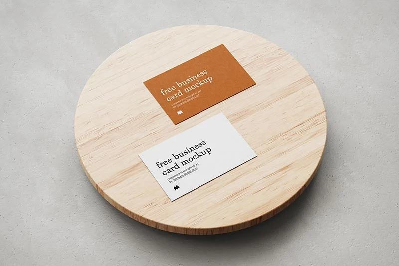 Business cards on wooden plate