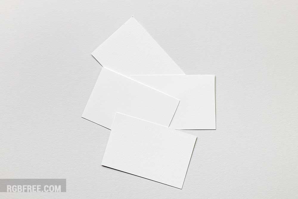 Few-business-cards-lying-on-paper-mockup-1