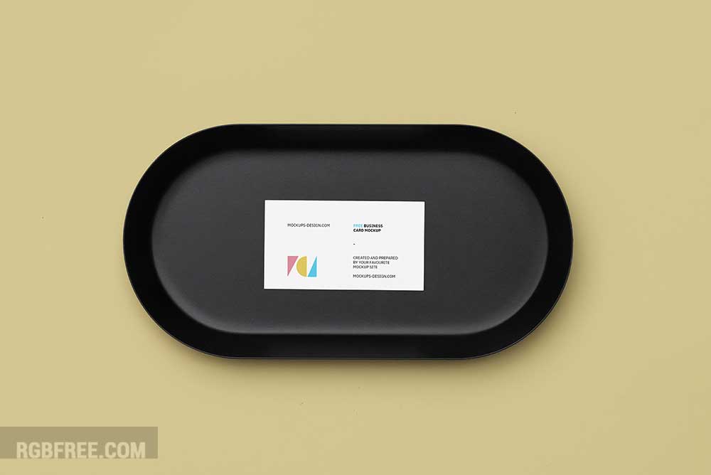 Business card on a black plate mockup